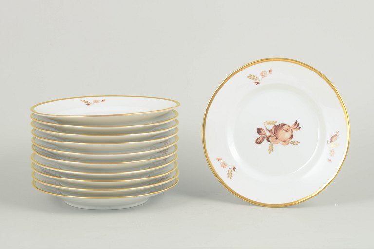 Royal Copenhagen brown rose, set of eleven plates.